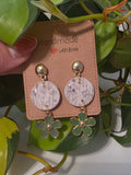 Gold with black and white flowers with green dangle accent flower earrings